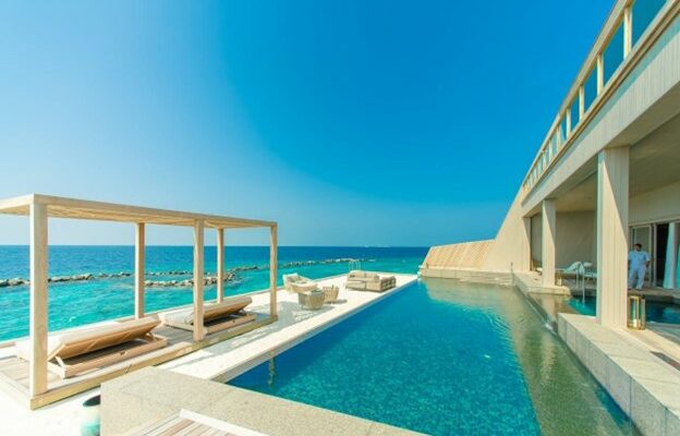 Gray outdoor lounge with a swimming pool on a beachside