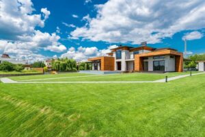 A modern house with a big lawn